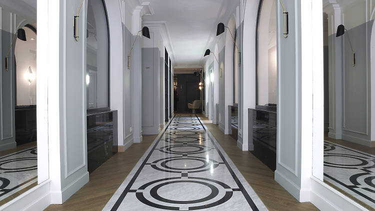 Glazed canopy and tiled floor inside the entrance hall of a Paris building